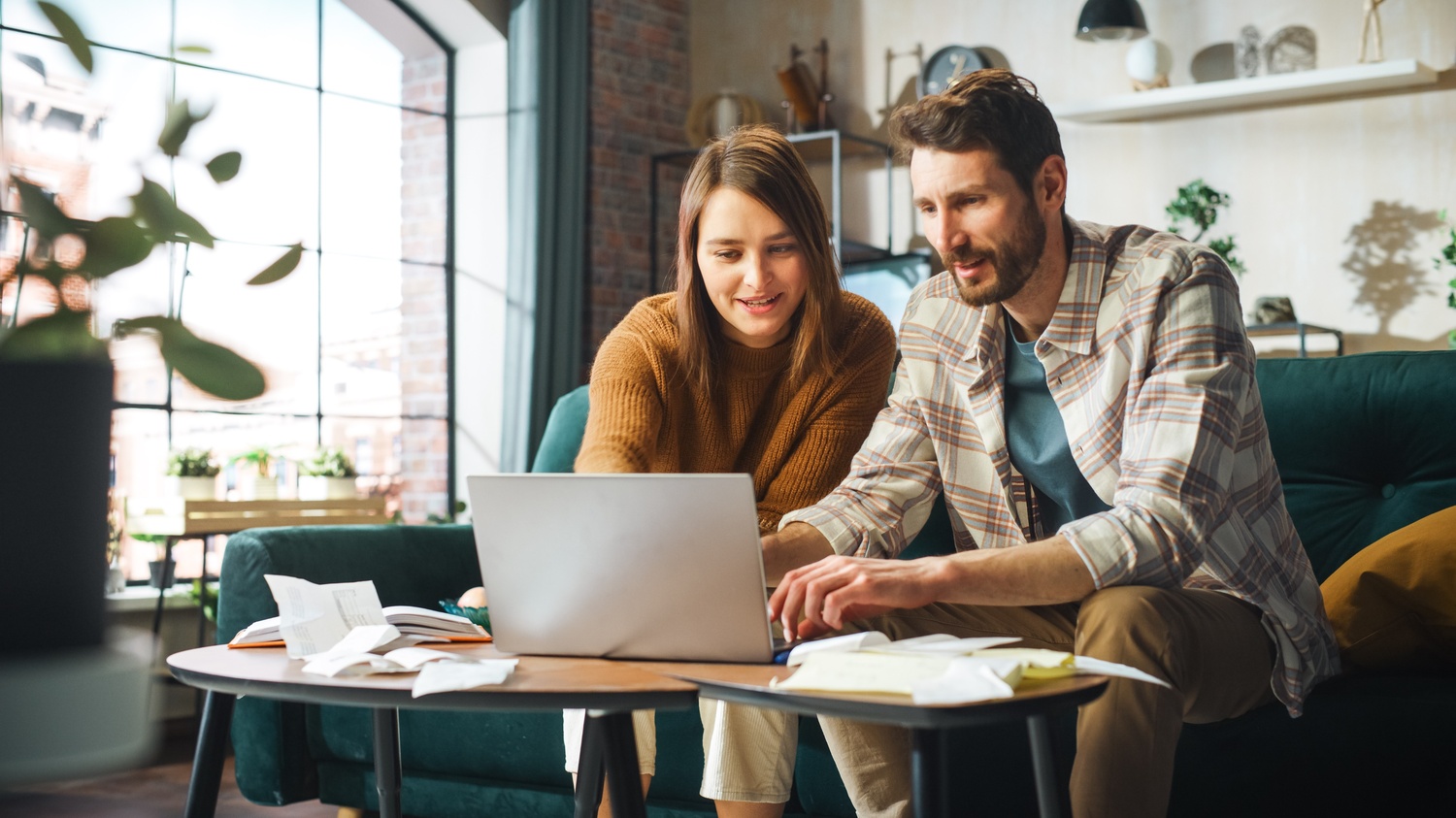 Small Business Networking Guide for Online Growth image happy couple using laptop computer, sitting on sofa in apartment